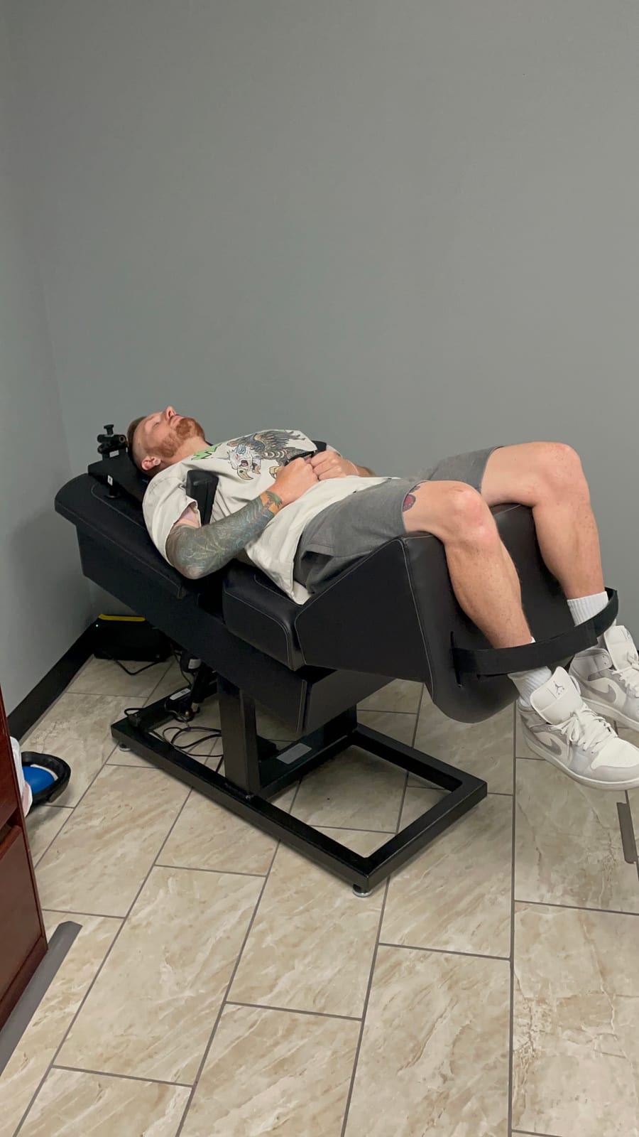 A patient seated and reclined during a treatment visit