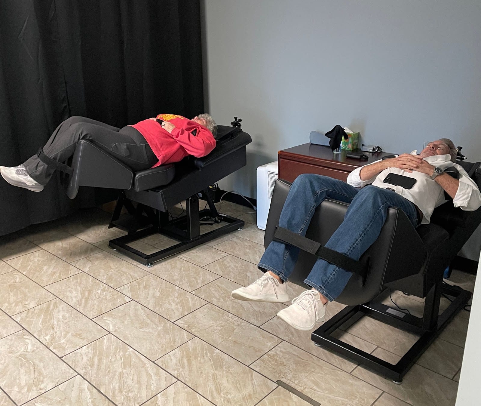 Two patients seated and reclined during treatment visits